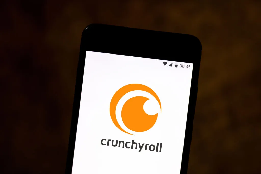 In this photo illustration a Crunchyroll logo seen displayed